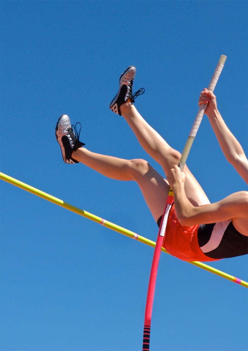 Pole vaulter in mid flight